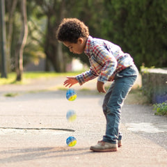 Colorful Moon Ball bouncing on playground