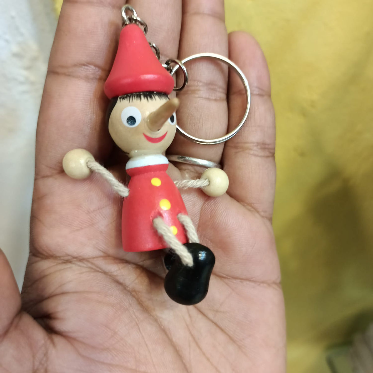Wooden pinocchio Nose Key chain - pack of 1 joker key chain