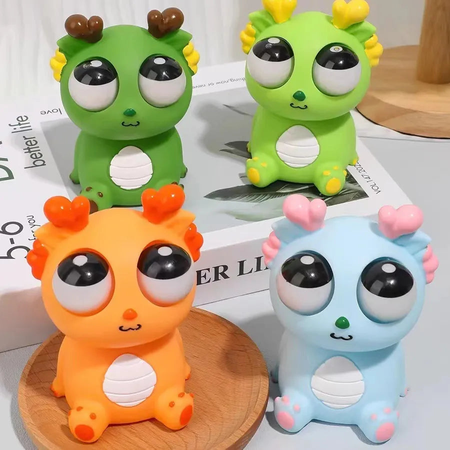 Cartoon Pop up Eye Lighting silicon Toy - Any 1 Random squishy toy