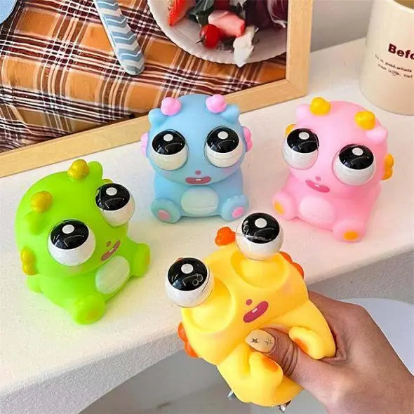 Cartoon Pop up Eye Lighting silicon Toy - Any 1 Random squishy toy