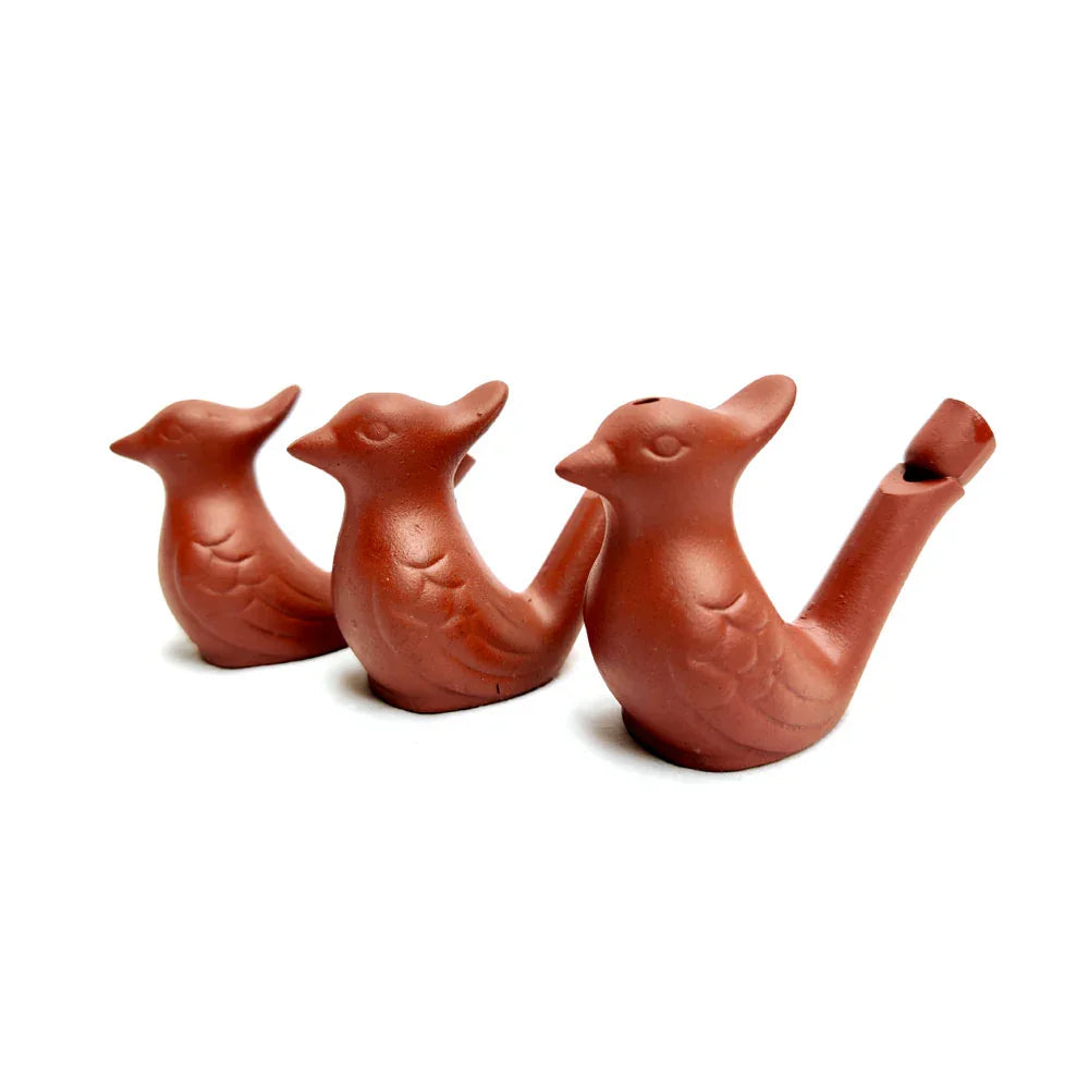 Three terracotta bird-shaped water whistles on a white background