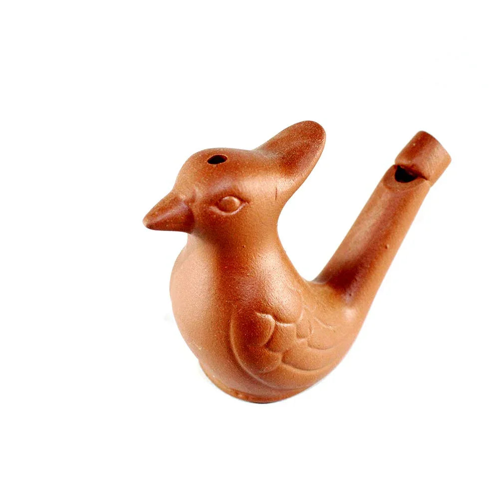 Terracotta bird-shaped whistle on a white background