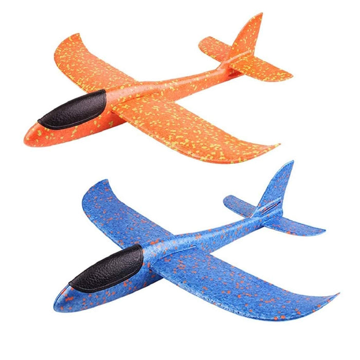 Two foam slant-style toy airplanes on a plain white background, one orange with yellow speckling and one blue with orange speckling, each with black nose sections.