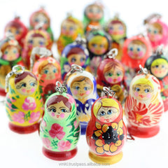 Colorful Russian nesting doll keychains on a white background