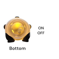 "Bottom view of the panda lamp showing the easy-to-use ON/OFF toggle switch and battery compartment."